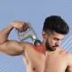 Ручний вібромасажер на акумуляторі з 4 насадками Fascial Gun KH-740 Сірий