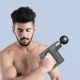 Ручний вібромасажер на акумуляторі з 4 насадками Fascial Gun KH-740 Сірий